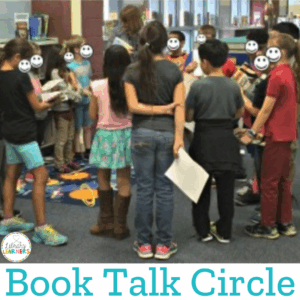 Students standing in school library with library books